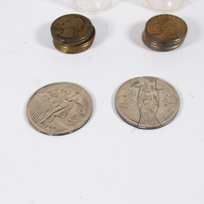 Two 1940's quarter stacks used for gambling or magic and an Adams coin and folding coin
