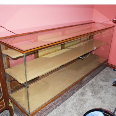 8 foot vintage showcase: marble bottom circa 1920