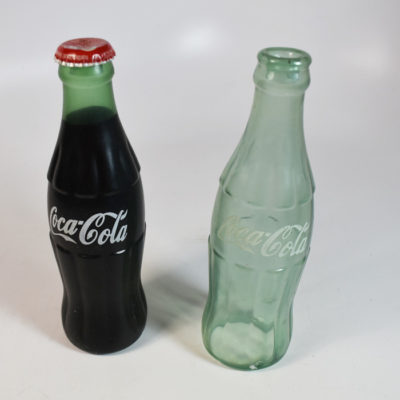 Nielsen Vanishing Coke Bottles: empty and full